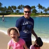 Kurt Schmidt on the beach with his daughter