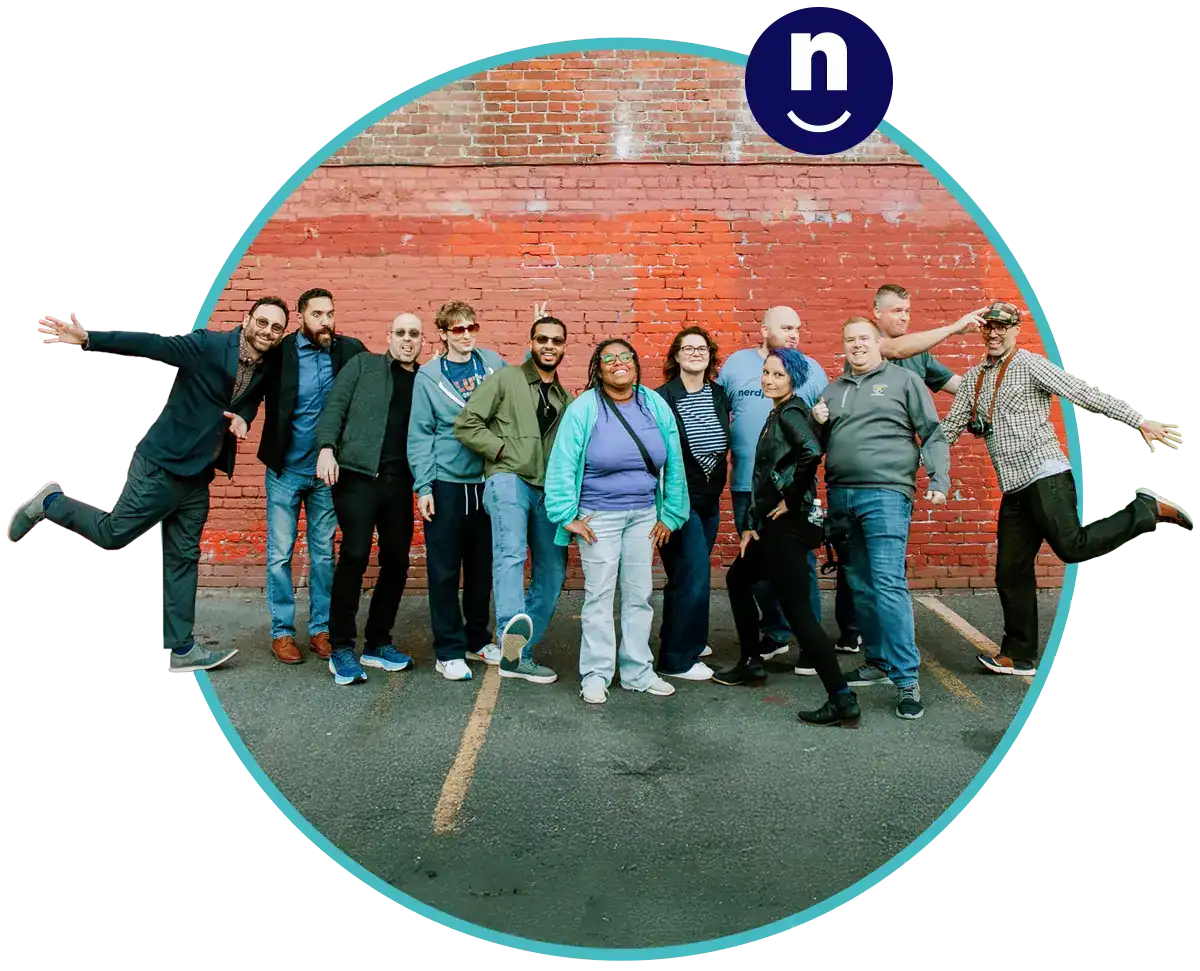 Some of our Nerds in a fun group photo, being a little goofy and smiling at you.